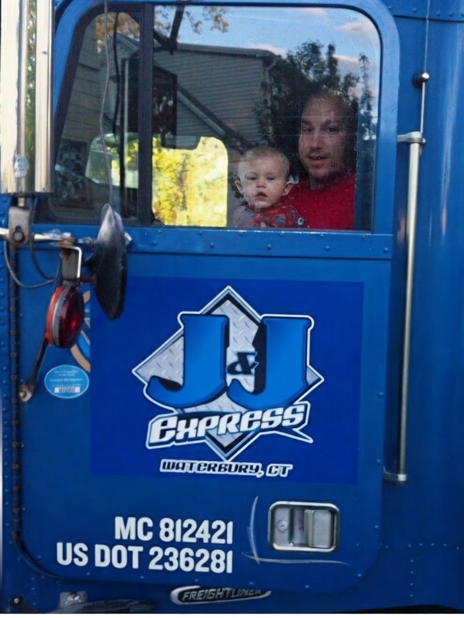 Technician ready to assist a commercial truck owner at the DeLand shop