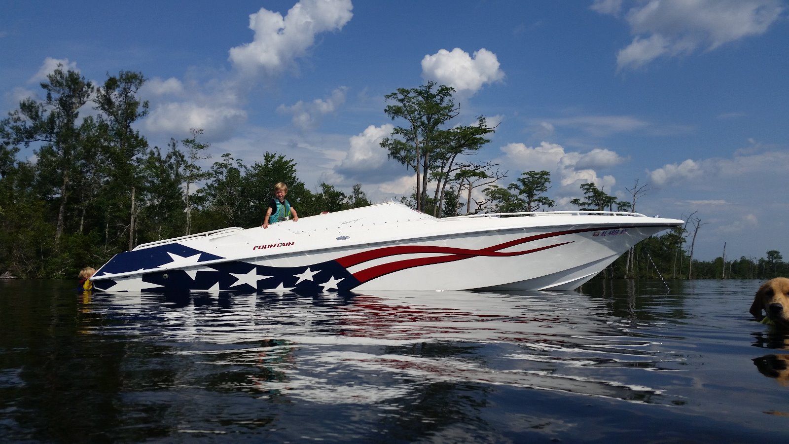Blue boat with crisp white lettering decals on hull