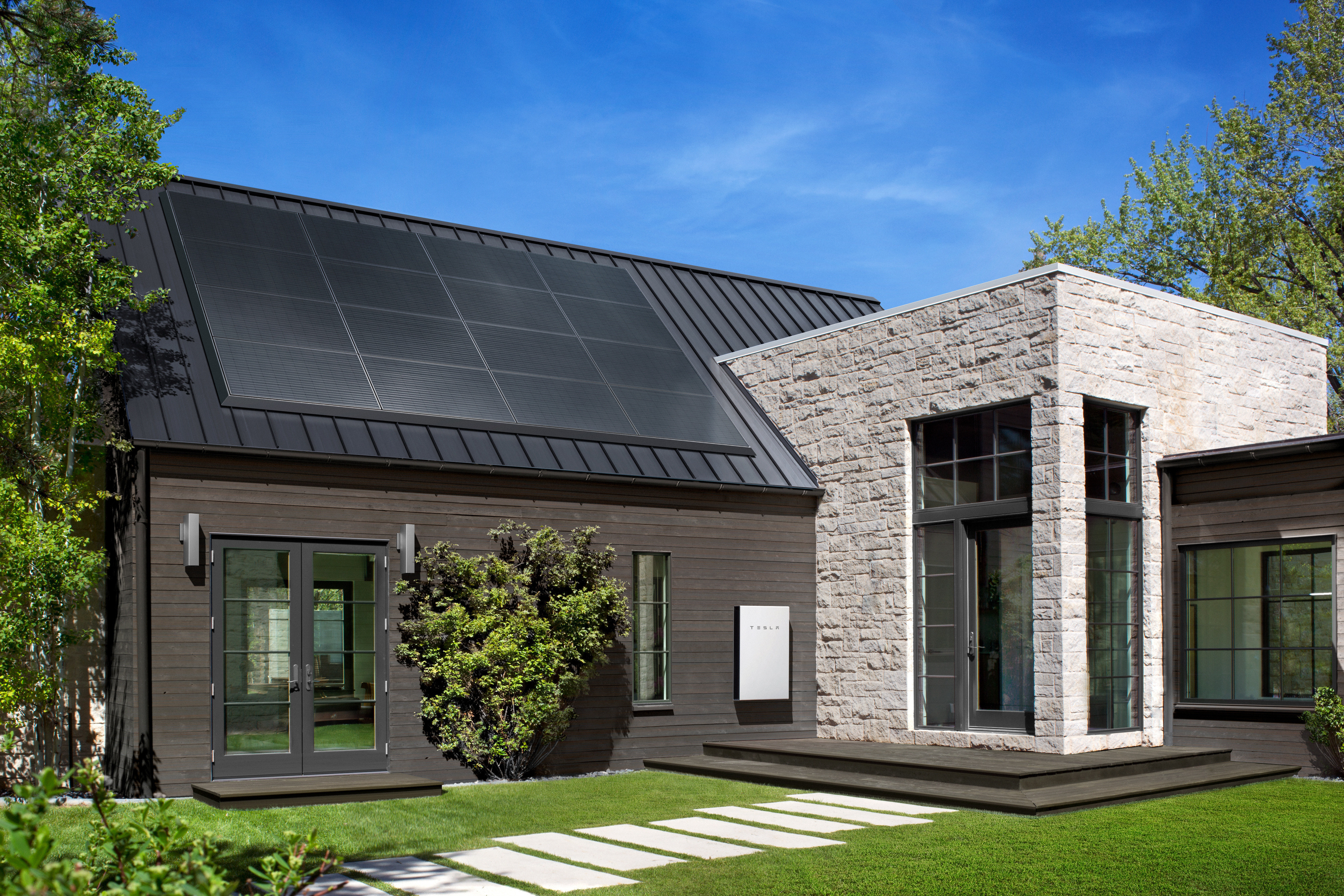A large house with solar panels on the roof