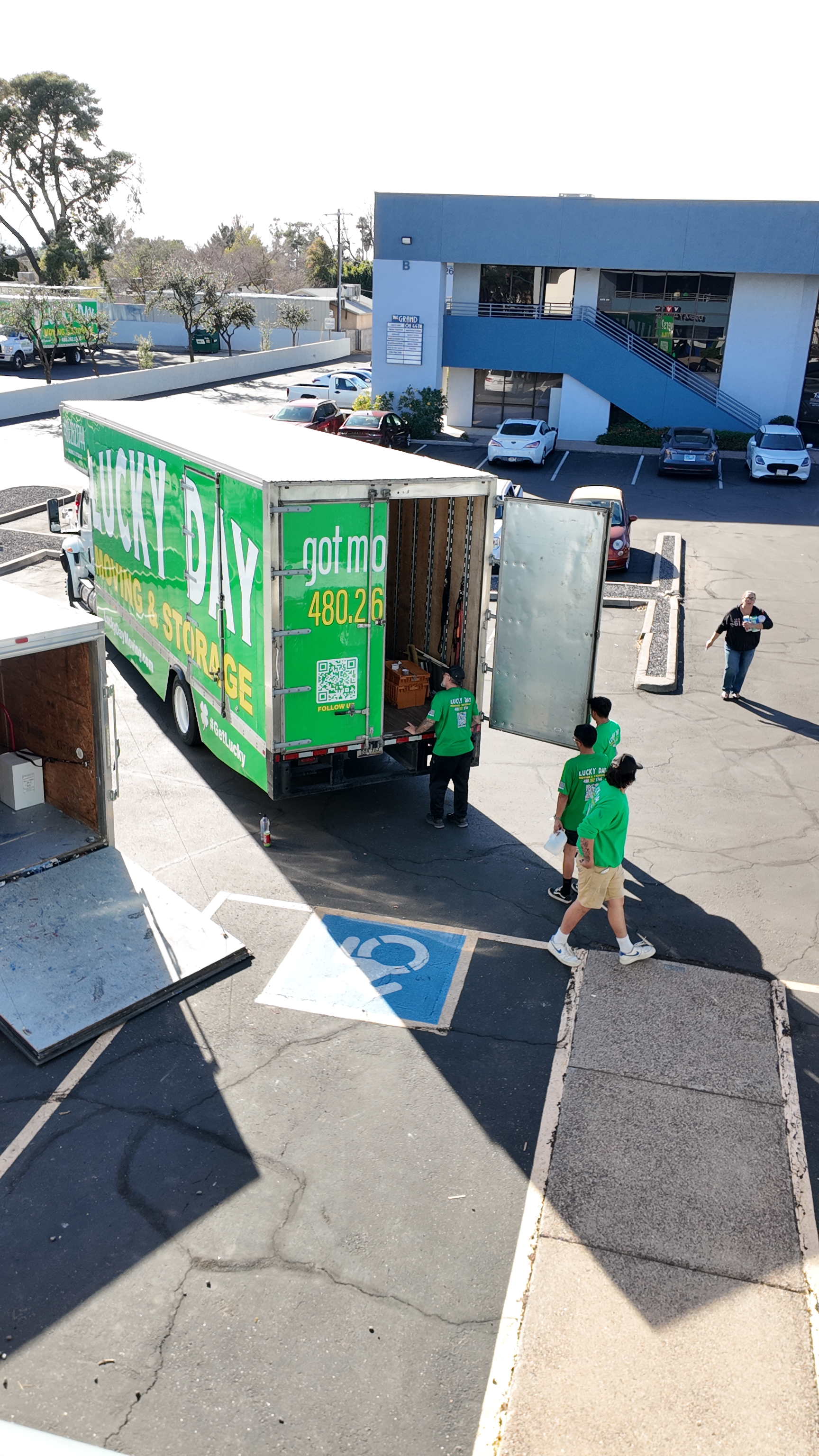 Two men unloading a delivery truck — Lucky Day Moving serving the East Valley, AZ