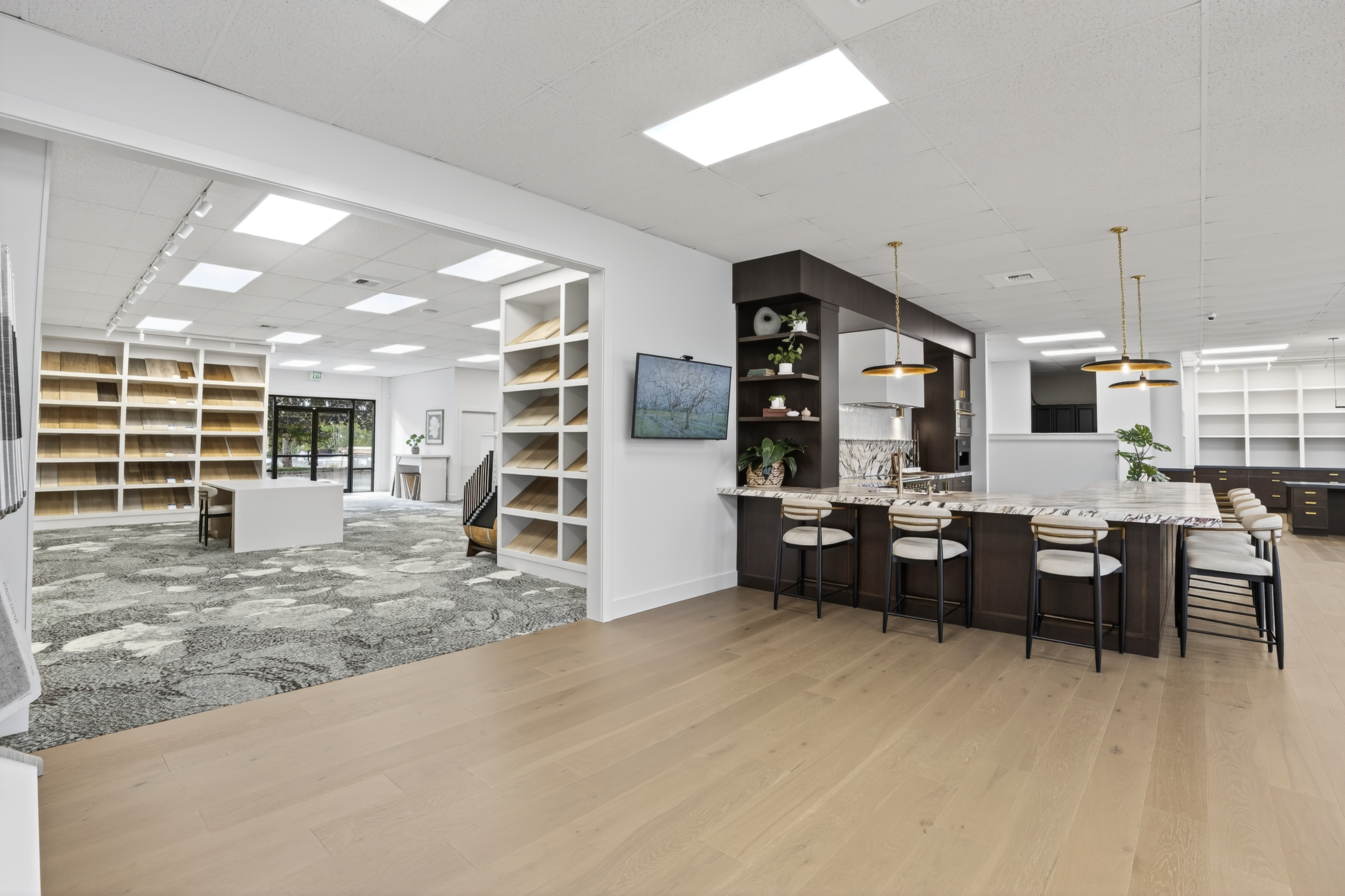 CR Floors showroom — white shaker cabinet kitchen display