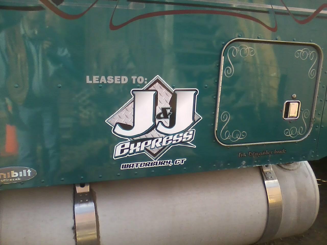 Truck door with custom vinyl lettering
