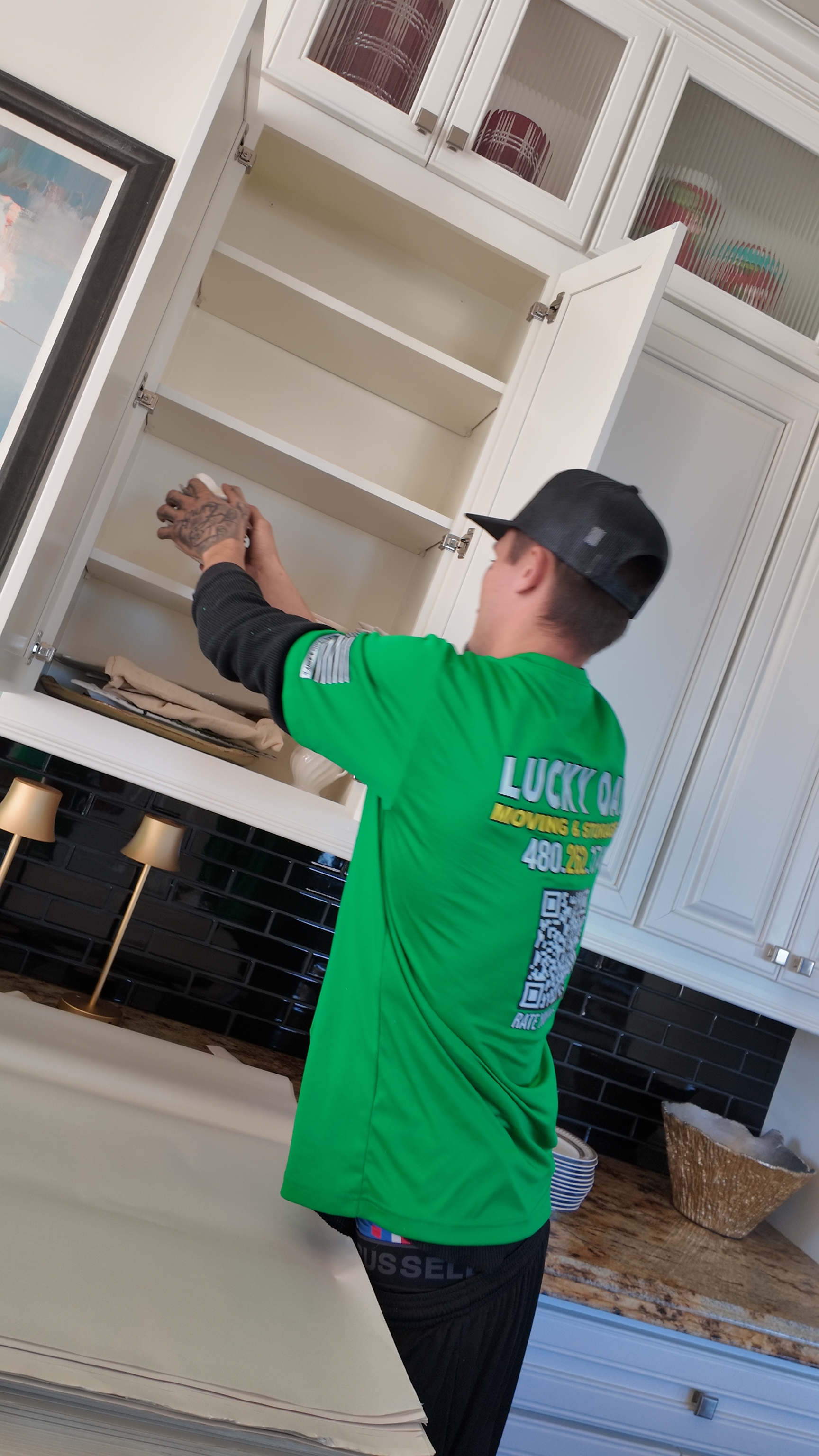 Moving crew unloading furniture from a truck — residential move in Gilbert, AZ