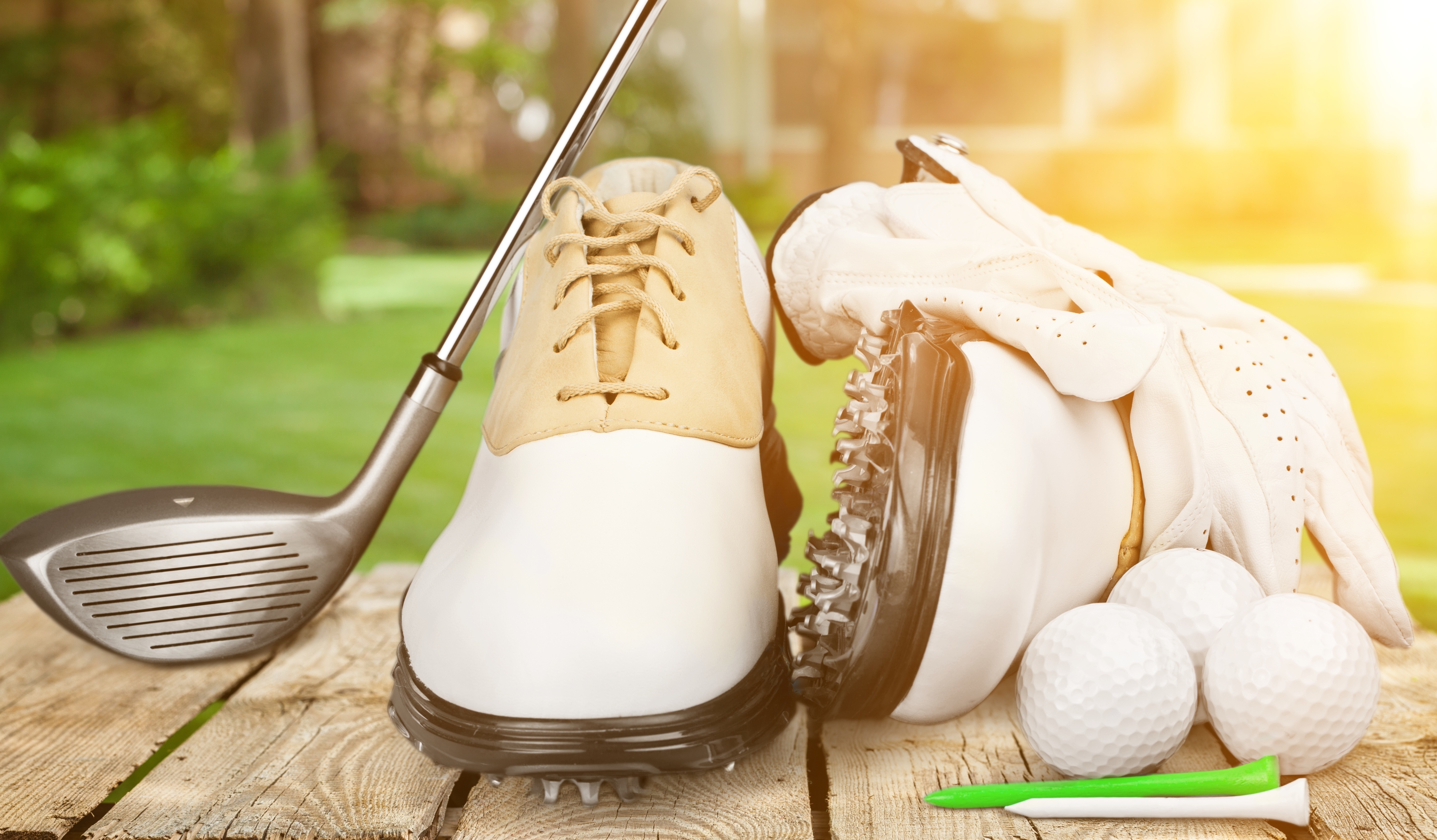 Golf equipment on green turf — OCK protects golf shoes
