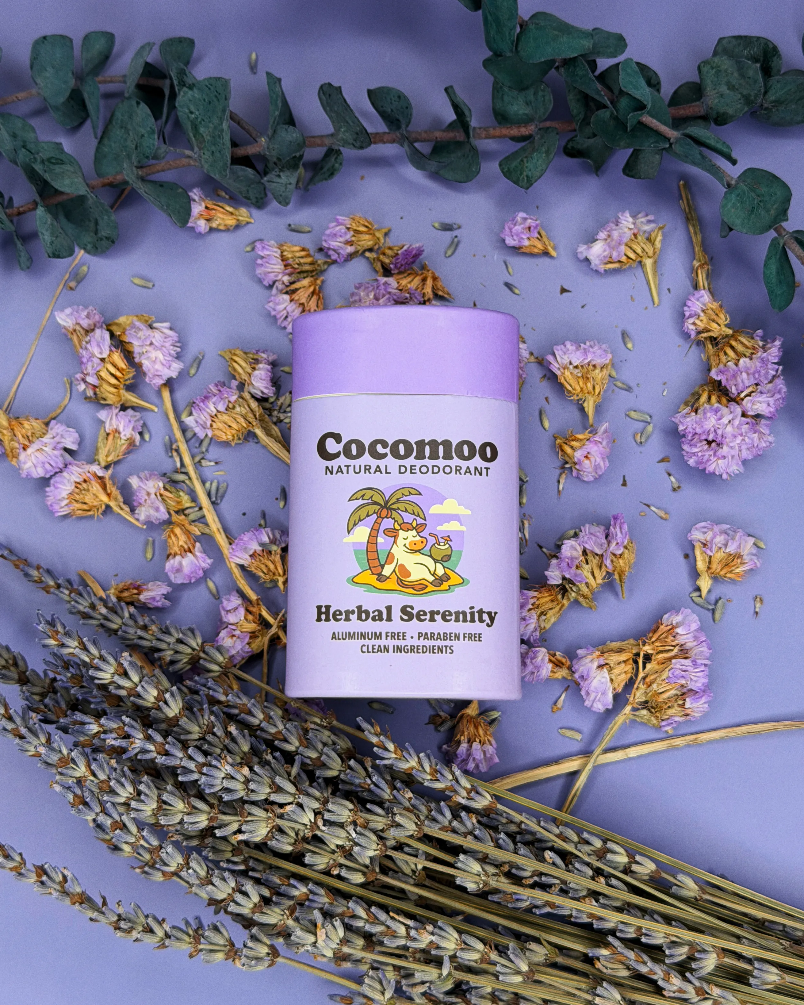 Herbal Serenity natural deodorant surrounded by dried lavender and eucalyptus.