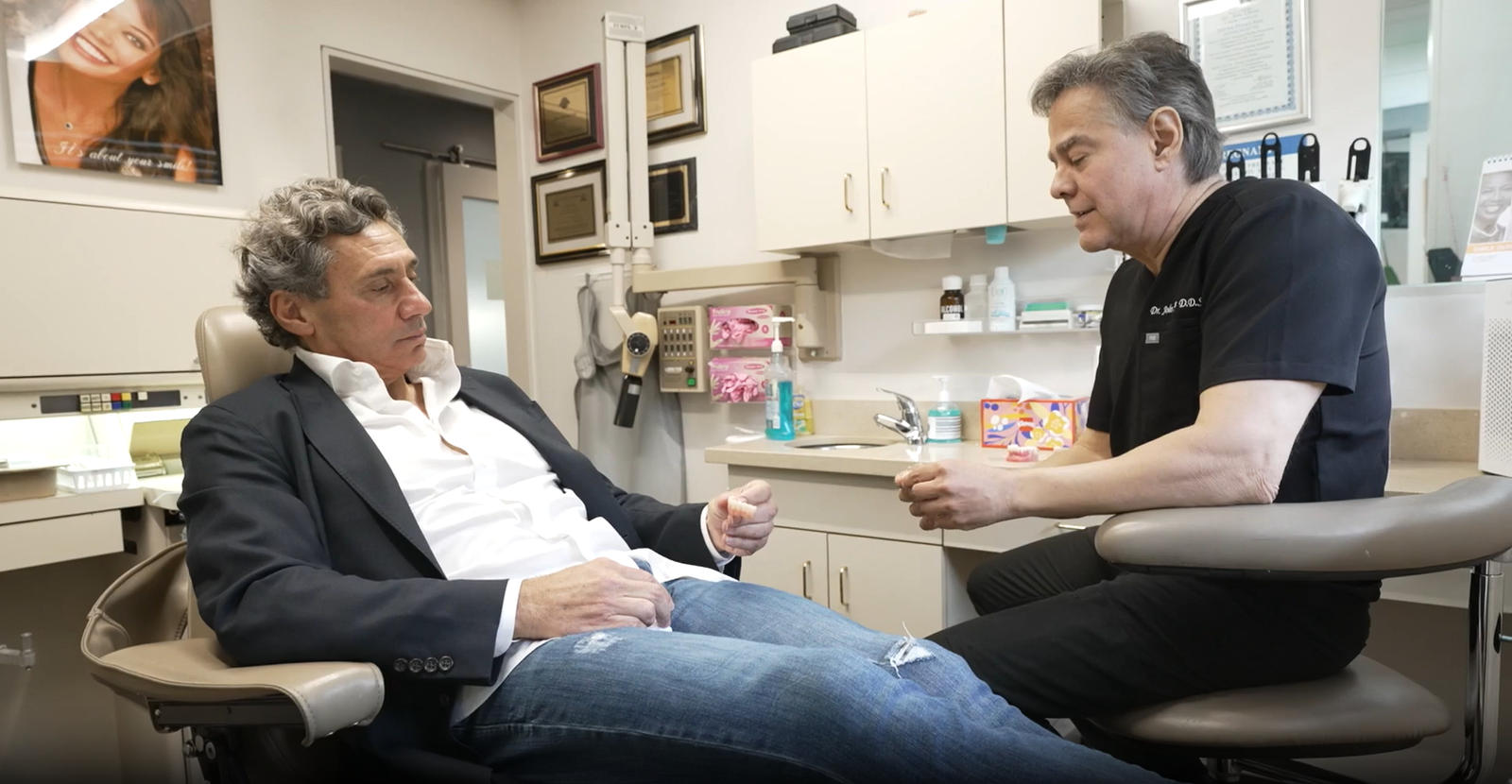 A doctor consulting with a patient in a Woodland Hills dental office, discussing smile makeover options