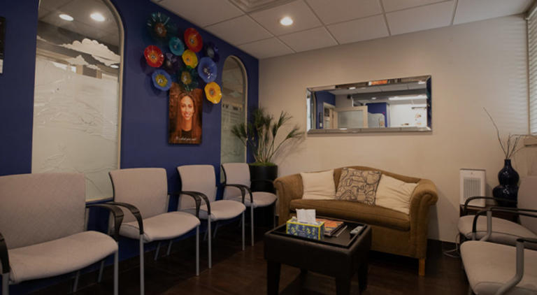 Comfortable, modern reception area at the Woodland Hills dental office