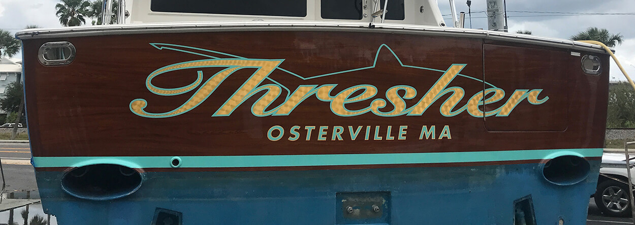 Hailing port lettering on boat transom