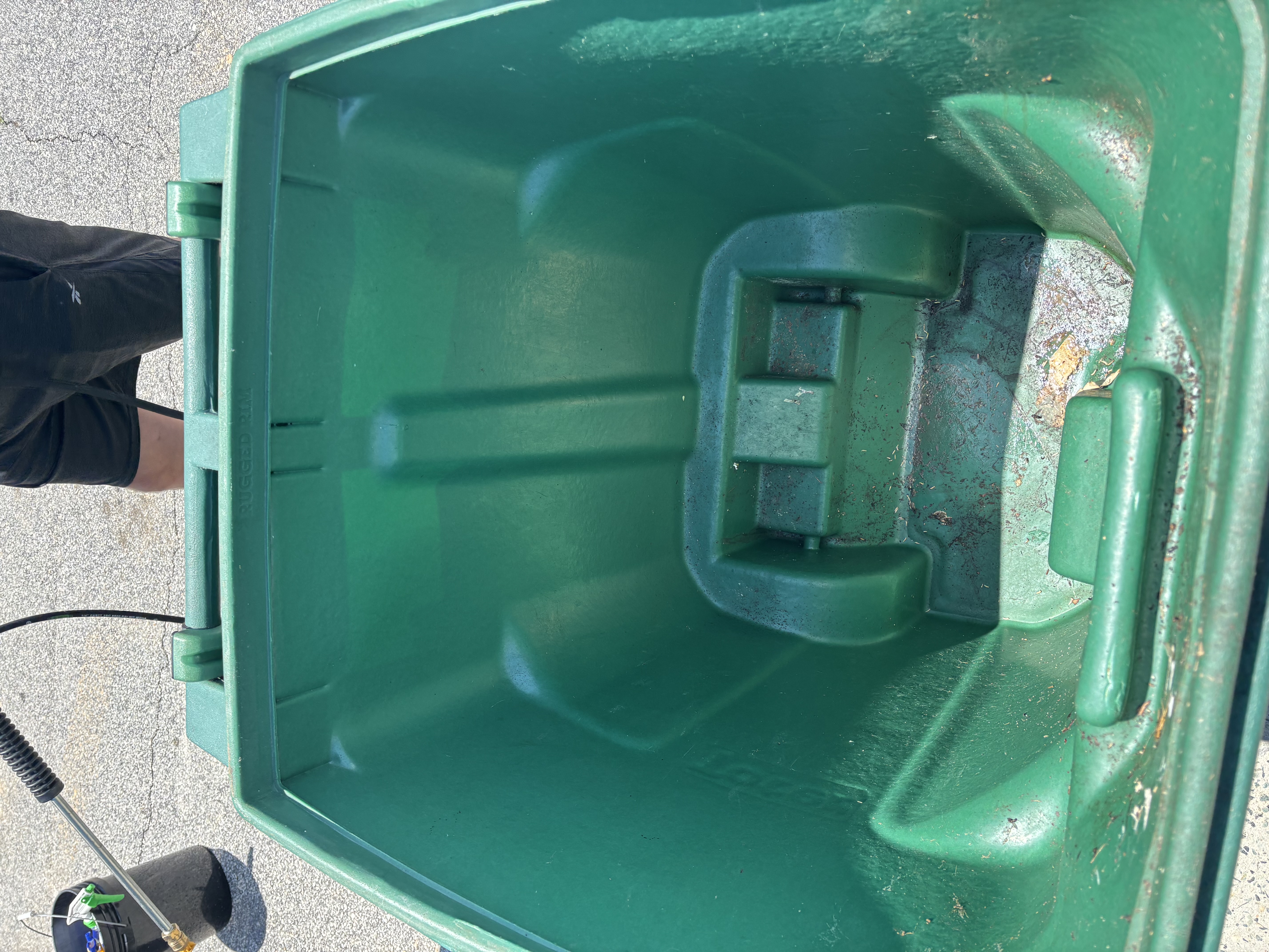 Dirty, grimy residential trash bin before cleaning